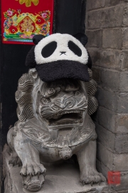 Pingyao 2013 - Hotel lion sculpture with panda hat